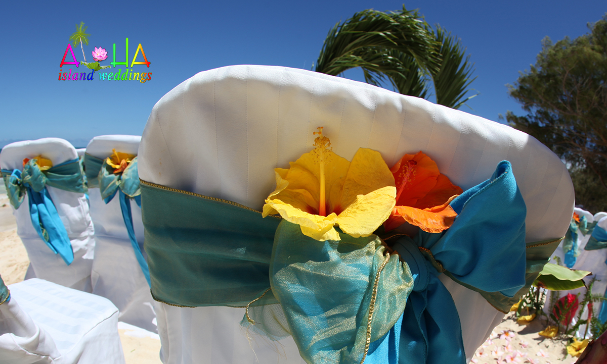 palm arch with acean blue and misty turquoise sash on white chair beach cover